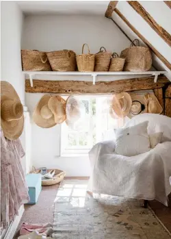  ??  ?? DRESSING ROOM
Top right An impressive collection of Cabbages & Roses baskets and Gil Fox straw hats are left on show