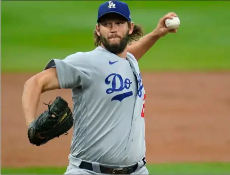  ?? AP Photo/David Zalubowski ?? Los Angeles Dodgers starting pitcher Clayton Kershaw works against the Colorado Rockies during the first inning of a baseball game on Saturday in Denver.