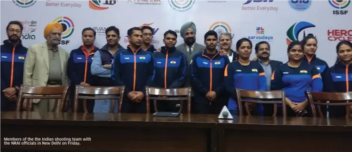  ??  ?? Members of the the Indian shooting team with the NRAI officials in New Delhi on Friday.