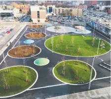  ?? JASON THORNE. ?? John Rebecca Park, a former 170-spot car park in Hamilton, is now a mix of green space, benches, tables and walkways.