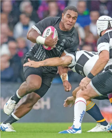  ?? Photo: Ian Muir ?? Man of the match Johnny Dyer leads an attack for the Fiji Airways Flying Fijians at Twickenham in London. Dyer scored two tries that saw the Flying Fijians claim a 33-31 victory against the Barbarians after 49 years.