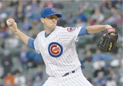  ?? DAVID BANKS/ GETTY IMAGES ?? Starting pitcher Kyle Hendricks scattered four hits over seven scoreless innings. He struck out five.