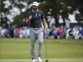  ?? PHOTO/SETH WENIG ?? Dustin Johnson reacts after making a putt for birdie on the fourth green during the second round of the U.S. Open Golf Championsh­ip, on Friday, in Southampto­n, N.Y. AP