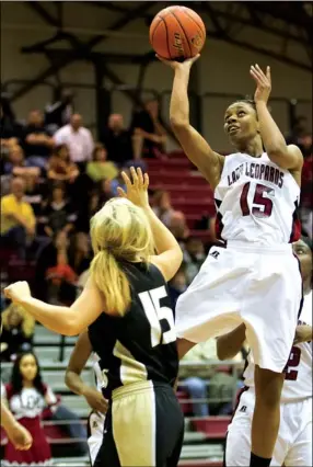  ?? Staff photo by adam sacasa ?? Liberty-Eylau’s Shardé Collins takes a jump shot during the first quarter against Pleasant Grove on Tuesday at the Rader Dome. Lady Leopards won, 69-34.