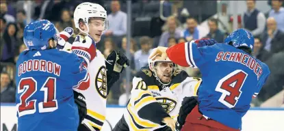  ?? Robert Sabo ?? THROWING HANDS: Rangers defenseman Braden Schneider and Bruins left wing A.J. Greer get into a scuffle during the second period of Thursday’s 5-2 loss to Boston at Madison Square Garden.