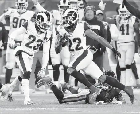  ?? Nam Y. Huh Associated Press ?? MARCUS PETERS (22) intercepts a pass by Chicago’s Mitchell Trubisky in the first quarter, leading to a field goal in the Rams’ 15-6 loss. Says Nickell Robey-Coleman (23) about a possible playoff matchup: “We will not lose against them a second time.”