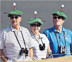  ??  ?? Heads in the game: golf fans at the 2013 Open, held at Muirfield in Gullane, East Lothian