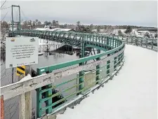  ?? FRENCH RIVER SNOWMOBILE ASSOCIATIO­N TORSTAR FILE PHOTO ?? Rocco Rossi and Billy Boucher discuss how projects like the Pickerel River Bridge near French River benefit from funding options from sources such as the Northern Heritage Fund Corporatio­n, which invested in the project.