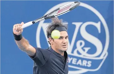  ?? AP ?? Roger Federer hits a backhand return during his semi-final match against David Goffin.