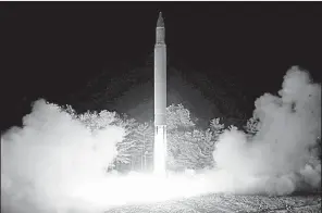  ?? AP ?? A photo distribute­d by the North Korean government shows what was said to be the launch of an interconti­nental ballistic missile on July 28. Analysts said the missile has the capability to reach Alaska, Los Angeles or Chicago if fi red at a normal, fl attened trajectory, and reports Tuesday indicated North Korea can now package the missile with a nuclear warhead.