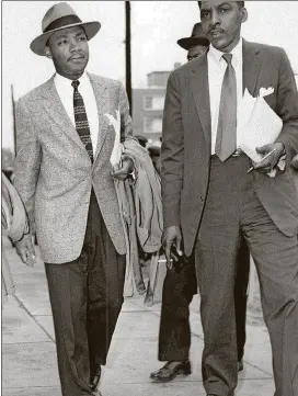  ?? AP PHOTO / FILE ?? Bayard Rustin (right) walks with the Rev. Martin Luther King Jr. in this 1956 file photo. Because he was openly gay, Rustin was a largely forgotten civil rights pioneer and strategist.