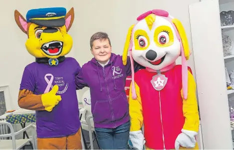  ?? Picture: Steven Brown. ?? Toby Etheridge with some of the Paw Patrol characters in Cupar at the new drop-in centre.