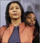  ?? JEFF CHIU — THE ASSOCIATED PRESS ?? San Francisco Board of Supervisor­s President and acting mayor London Breed, left, stands in front of Supervisor Malia Cohen at a news conference at City Hall in San Francisco, Tuesday.
