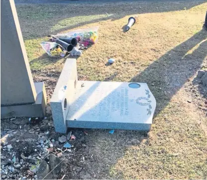  ??  ?? Headstone memorials to Frank and Peter Ward were broken at Hillend Cemetery.