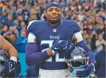  ?? AP PHOTO/GEORGE WALKER IV ?? Running back Derrick Henry stands for the national anthem before the Tenenssee Titans’ home game against the Jacksonvil­le Jaguars on Jan. 7. Henry, who turned 30 in early January, is about to become a free agent for the first time since the Titans selected the former Alabama star in the second round of the 2016 NFL draft.