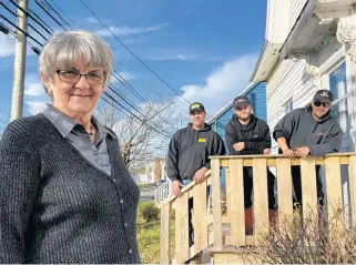 ?? CARLA ALLEN ?? Homeowner Marie Atkinson with some of the contractor­s, Nick Hurlburt (N Hurlburt Excavating Ltd.), Jesse Gallagher and Tim Atkinson (Bramac), who helped her resolve a drainage problem as a surprise Christmas present.