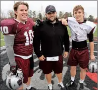  ?? Arkansas Democrat-Gazette/RICK McFARLAND ?? The move from Lincoln to Benton has paid off in more ways than one for defensive coordinato­r Brad Harris (center) and his sons Drew (right) and Brayden.