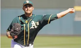  ?? DARRON CUMMINGS/ASSOCIATED PRESS ?? A’s pitcher Sean Manaea allowed six runs and five hits over three innings against the Reds.