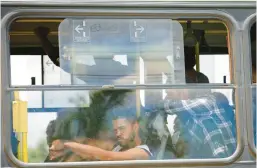  ?? GUSTAVO MORENO/AP ?? Supporters of former Brazilian President Jair Bolsonaro who were arrested following riots this week are taken by bus to a federal prison Wednesday in Brasilia, Brazil.