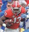  ?? / Joshua L. Jones-Athens Banner-Herald via AP ?? Georgia rotates running backs effectivel­y and it shows in their yards per carry. Elijah Holyfield (pictured) has averaged 7.4 yards per rush, DeAndre Swift 4.9, Brian Herrien 6.3 and James Cook 5.5.