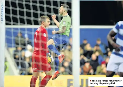  ??  ?? > Joe Ralls jumps for joy after burying his penalty kick