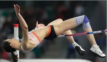  ?? Associated Press ?? Up and over: Mariya Lasitskene competes in the women's high jump final during the Match Europe against USA athletics competitio­n on the Dinamo stadium in Minsk, Belarus. Three-time high jump world champion Lasitskene will be a favorite at the upcoming Tokyo Games after Russia named her to its 10-athlete team under rules limiting the size of its squad because of a long-running doping dispute.