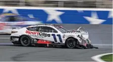  ?? AP PHOTO/MATT KELLEY ?? Denny Hamlin (11) comes to a stop after crashing on the front stretch during Monday’s Coca-Cola 600 at Charlotte Motor Speedway.