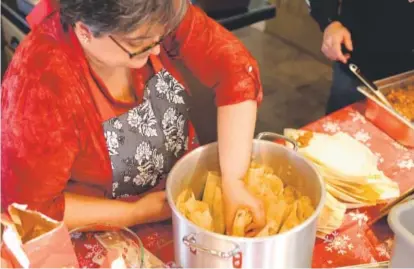  ??  ?? Linda Shapley hosts “Tamale Day” every year to kick off the holidays. Her family gets together to make a big batch of tamales. Photos by Amy Brothers, The Denver Post