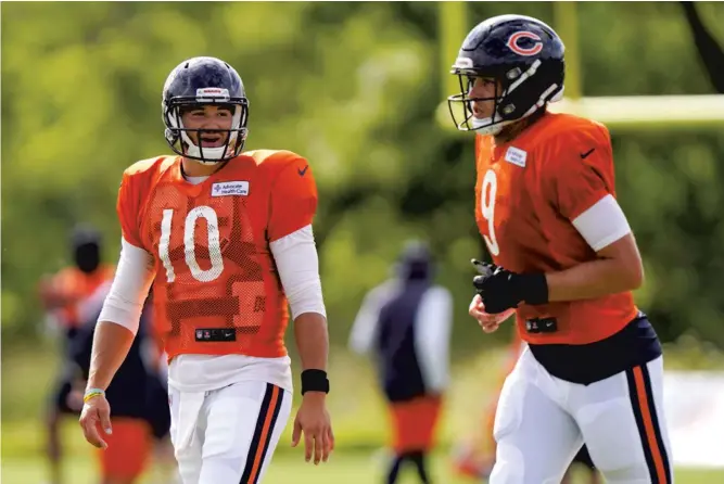 ?? NAM Y. HUH/POOL / GETTY ?? Mitchell Trubisky #10 of the Chicago Bears talks with Nick Foles #9 during training camp at Halas Hall on August 18, 2020 in Lake Forest, Illinois.