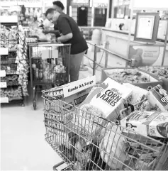  ??  ?? People shop at a Food Town grocery store during the aftermath of Hurricane Harvey in Houston, Texas. — AFP photo