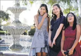  ??  ?? SHANTI, Mia and Annsana, from left, at their first formal dance, in March. Social outings for Early Entrance Program students include trips, dances and sports.