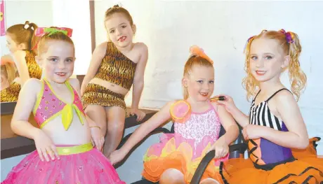  ??  ?? In the dressing room getting ready to take to the stage on the first day of competitio­n on Friday are six and under modern/jazz solo dancers (from left) Annika Spratt, Anna Ingram and Asher Burton of KC’s School of Dance and Olivia Rhodes from Studio...