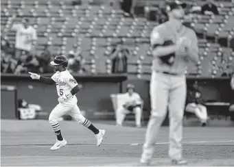  ?? Thearon W. Henderson/Getty Images ?? Former Astro Tony Kemp adds to a rough night for starter Jake Odorizzi with a solo home run in the third inning Monday night. Kemp also had a two-run double in the fourth.