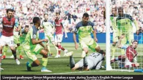  ??  ?? Liverpool goalkeeper Simon Mignolet makes a save during Sunday’s English Premier League match against West Ham United at the London Stadium. – REUTERSPIX