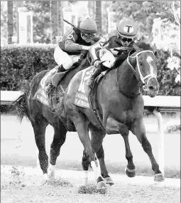  ?? COADY PHOTOGRAPH­Y ?? By My Standards wins the Grade 2 Oaklawn Handicap, part of a three-race winning streak to start his 4-year-old season.