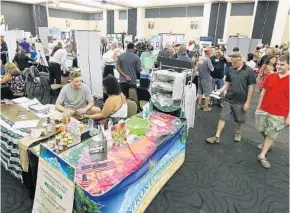  ?? PHOTOS BY STEPHEN M. DOWELL/STAFF PHOTOGRAPH­ER ?? Patrons browse the booths at the Orlando Marijuana Expo on Saturday at UCF. The event drew nearly three dozen businesses, advocacy groups and educationa­l centers from across Florida.