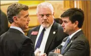  ?? ALYSSA POINTER/ALYSSA.POINTER@AJC.COM/FILE ?? Rep. Micah Gravely (center), a sponsor of medical marijuana legislatio­n: “It seems as if we’re met with roadblock after roadblock when we simply want to help people in need.”