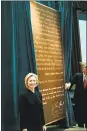  ?? GERALD MARTINEAU — WASHINGTON POST ?? Then-first lady Hillary Rodham Clinton stands beside a plaque honoring her contributi­ons to worldwide developmen­t in 1999.