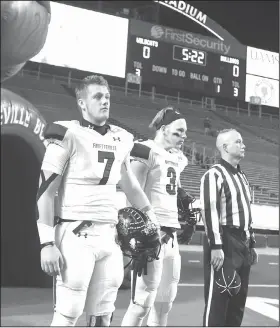  ?? File Photo/NWA Democrat-Gazette ?? Fayettevil­le’s Taylor Powell (7) and Barrett Banister (3) get ready to go out for the coin toss Dec. 2 before the Class 7A state championsh­ip game against North Little Rock at War Memorial stadium in Little Rock.