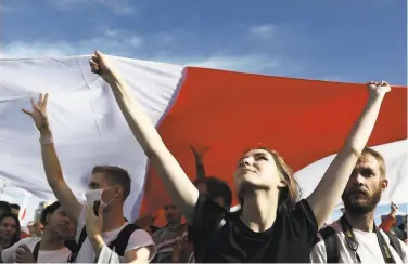  ?? TUT.BY / AFP via Getty Images ?? Opponents of President Alexander Lukashenko demand his resignatio­n at a protest Sunday in Minsk.