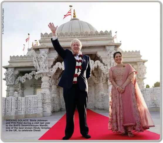  ?? ?? SEEKING SOLACE: Boris Johnson and Priti Patel during a visit last year to the BAPS Swaminaray­an Mandir, one of the best known Hindu temples in the UK, to celebrate Diwali