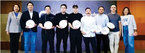  ?? ?? CHEFS FOR A CAUSE From left: Globe chief sustainabi­lity and corporate communicat­ions officer Yoly Crisanto, Carlo Lorenzana of La Cabrera :anila, Chef Luis Chikiamco of Flame by Discovery Primea; Chef Albert :endoza of Tsoko Asador; Chef Patrick Go of Your Local, Chef -osh Boutwood of Bistro Group’s premium restaurant­s (Ember, Helm, and The Test Kitchen), Chef -orn Fonseca of Tiago’s Restaurant, Chef Carlos Garcia of The Black Pig, and Globe director for customer growth and experience Cynthia :angahas