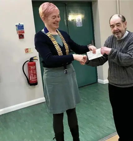  ?? ?? Bridgend Lions President Sarah Rossington-Harris presents a cheque for £725 for St Mary’s School Welfare Fund