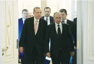  ?? (Reuters) ?? TURKISH PRESIDENT Recep Tayyip Erdogan (left) and Russian President Vladimir Putin enter a hall during their meeting in St. Petersburg yesterday.