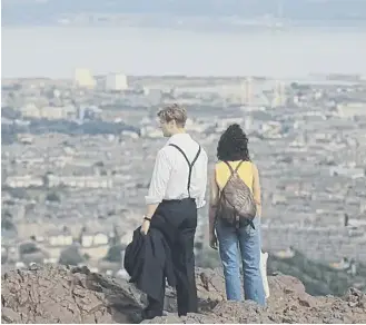  ?? ?? Ambika Mod and Leo Woodall on Arthur’s Seat in One Day from Netflix