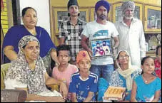  ?? HT PHOTO ?? Family members of Palbinder Kaur Shergill at Jagatpur village of Shaheed Bhagat Singh Nagar district on Saturday.