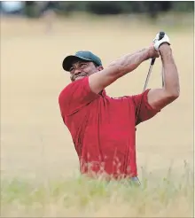  ?? PETER MORRISON THE ASSOCIATED PRESS ?? Tiger Woods plays out of a bunker on the 10th hole during the final round for the 147th British Open Golf Championsh­ip in Carnoustie, Scotland, on Sunday. Woods finished in a three-way tie for sixth at five under par.
