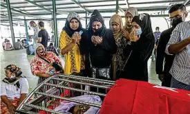  ?? EPA ?? Custody death: Khin Maung Latt is mourned at his funeral in Yangon yesterday