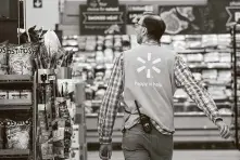  ?? Mark Lennihan / Associated Press ?? In October, all of Walmart’s U.S. supercente­r locations will switch to a new team-based model for employee staffing. About 165,000 staffers are expected to see a raise.