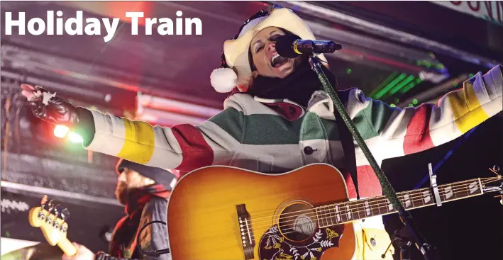  ?? SCOTT ANDERSON/SOUTHWEST BOOSTER ?? For the second year in a row Terri Clark was one of the featured performers at the CP Holiday Train stop in Swift Current. The rare night time train stop on December 6 featured musical performanc­es by Clark, Sierra Noble and Kelly Prescott. A large crowd in attendance donated over 1,000 pounds of food for the Salvation Army Food Bank and $1,447 was raised in support of the Salvation Army Christmas Appeal.